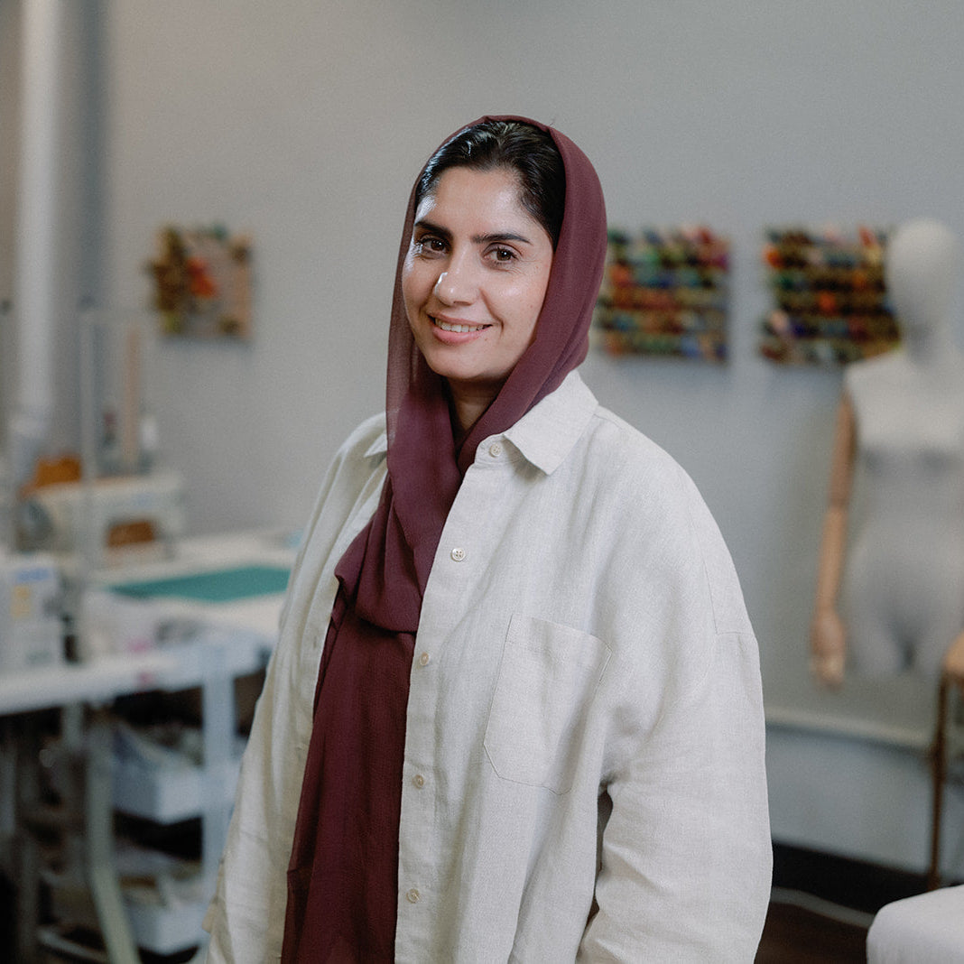 Habiba, originally from Afghanistan, came to the U.S. to escape severe restrictions on women, including the inability to work, attend school, or go outside alone. The birth of her daughter motivated her to seek a place where they would both be able to live and work freely. She often describes Renew as “my love,” where her talent and passion for sewing have flourished. The artisans and volunteers there have become her second family, offering creative collaboration and support.